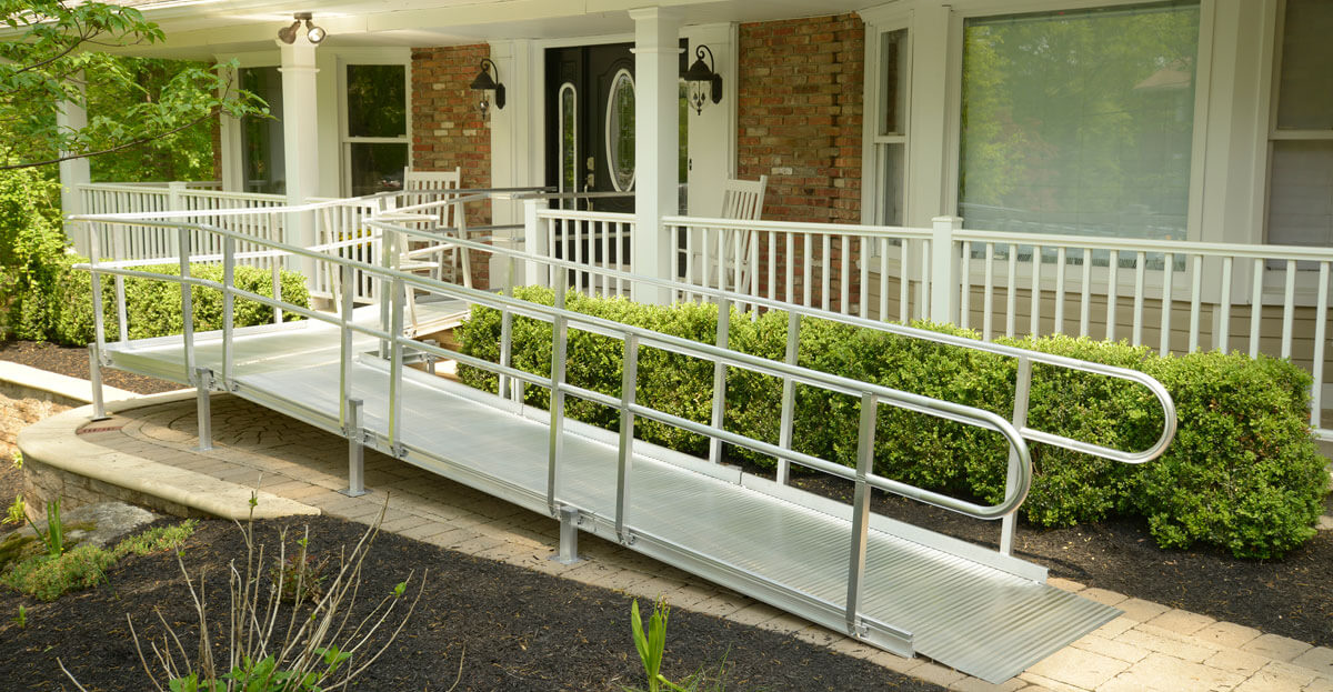 Residential accessibility ramp leading to a covered front entrance